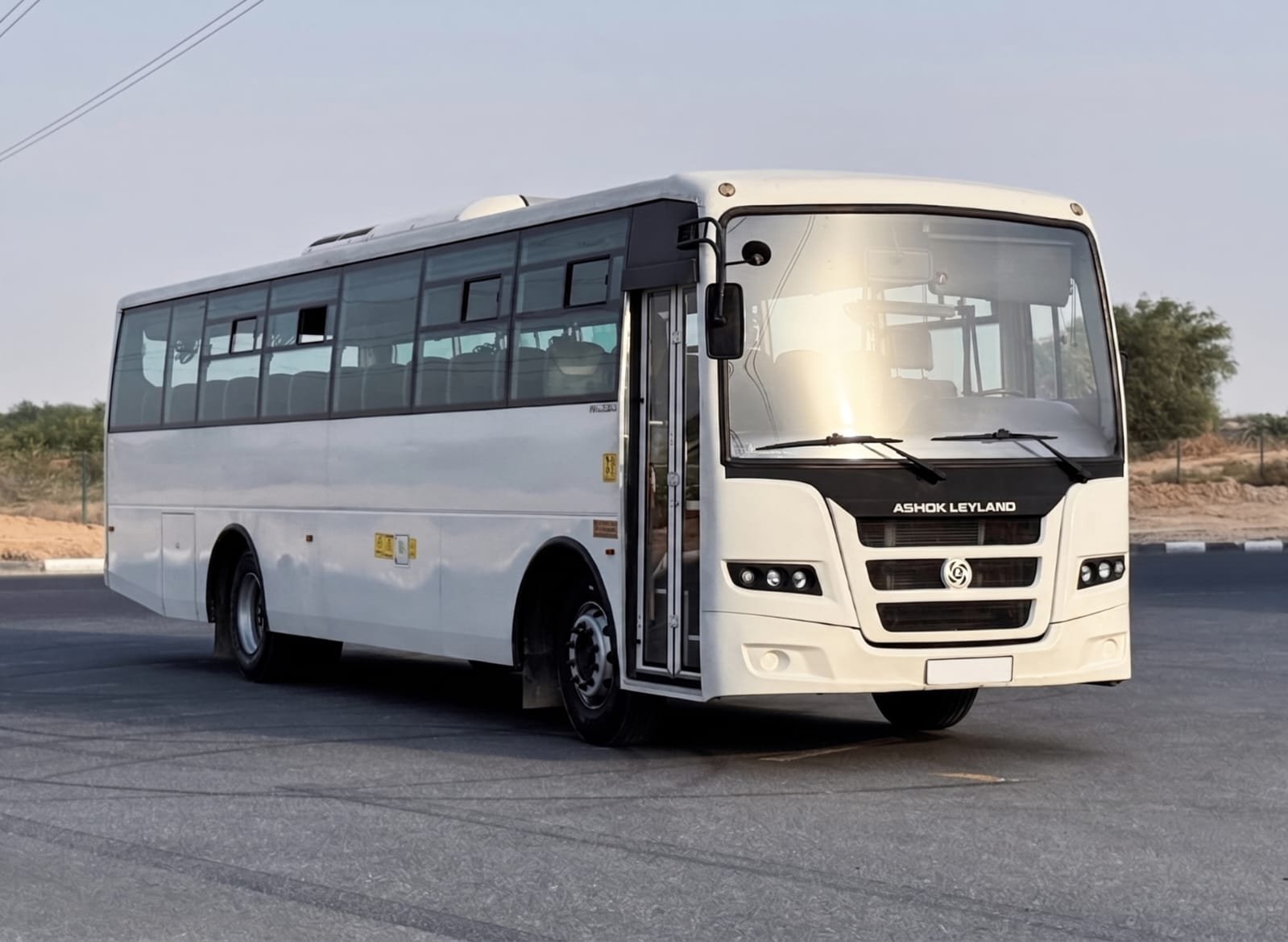 Illustrative 66-seat AC bus fleet visual for staff transport in Dubai